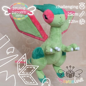 May include: A plush toy creature with light green skin, dark green accents, and large pink wing-like ears. The toy features white claws and measures 25cm in height. Text on the image includes "sewing pattern digital", "challenging", "25cm", and "12h+".