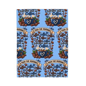 May include: A light blue fabric featuring a repeating pattern of dark blue coffee mugs with white heart icons, surrounded by brown coffee beans and green leaves. The text reads "A POEM FOR MORNINGS" and "Coffee, coffee, coffee, coffee, coffee, coffee, Everyone shut up. Coffee."