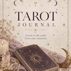 May include: A Tarot Journal with a cream cover featuring gold celestial illustrations, the text "TAROT JOURNAL" and "Listen to the cards. Trust your intuition." A deck of dark purple cards with gold sun and moon designs rests on a lavender fabric.