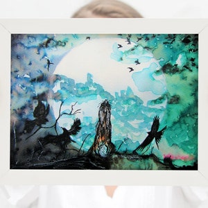 May include: A framed watercolour painting depicting a dark silhouette of a woman standing in a forest with a full moon in the background. The sky is painted in shades of blue and green, with birds flying overhead.