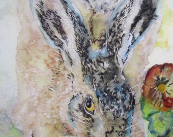 May include: Watercolor painting of a brown and gray rabbit with blue and white fur on its ears. The rabbit is looking down at a yellow and red flower. The painting is signed "Morena Artina 2013" in the top right corner.