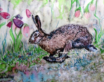 May include: Watercolor painting of a brown rabbit in a field of green and pink flowers. The rabbit is looking to the left of the image. The painting is signed "Morena Arlina 2013" in the bottom left corner and "Copyright Morena Arlina 2013" in the bottom right corner.