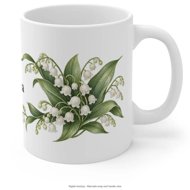 May include: A white ceramic mug featuring a botanical illustration of lily of the valley flowers with green leaves and small white bell-shaped blossoms. The design is centered on the front of the mug, which has a smooth finish and a curved handle.