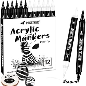 May include: A set of 12 PAGATHER dual-tip acrylic markers in black and white, featuring a box with a zebra illustration. The set includes six black and six white markers, two loose markers, and two painted stones with floral and heart designs.