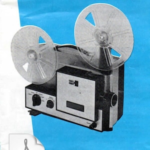 May include: A black and silver 8mm film projector with two clear film reels. The projector has a control panel with knobs and a small window. The instruction manual is labeled "INSTRUCTION MANUAL" in white text on a blue background.