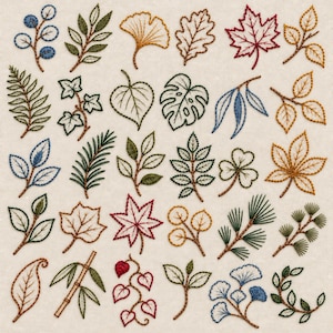 May include: A collection of various embroidered leaves and botanical elements stitched onto a light beige fabric. The designs feature diverse shapes including maple, oak, ginkgo, and fern leaves in shades of green, red, blue, and yellow.