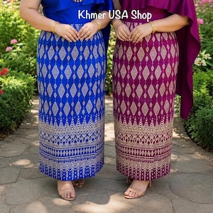 May include: Two long skirts featuring a repeating diamond pattern in gold thread. One skirt is royal blue and the other is deep magenta. Both skirts have a detailed gold border at the hem. The text Khmer USA Shop is visible in the center.