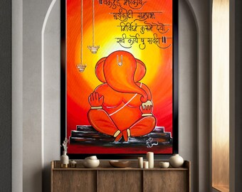May include: A framed rectangular wall art piece featuring a vibrant orange and red painting of a seated deity with an elephant head. The artwork includes black Sanskrit calligraphy at the top and two hanging oil lamps on the left side.