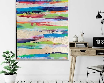 May include: A rectangular canvas painting featuring horizontal bands of vibrant colors including bright orange, deep blue, lime green, and magenta, interspersed with textured metallic gold leaf sections across the entire composition.