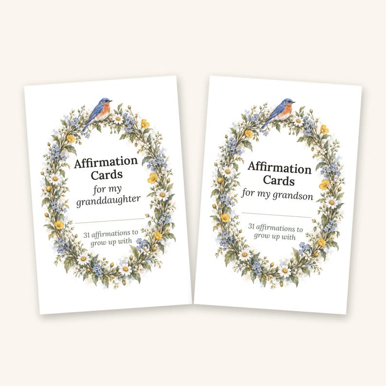 May include: Two white rectangular affirmation card sets featuring a floral wreath illustration with a blue bird. One set reads Affirmation Cards for my granddaughter, the other reads Affirmation Cards for my grandson, both with 31 affirmations to grow up with.