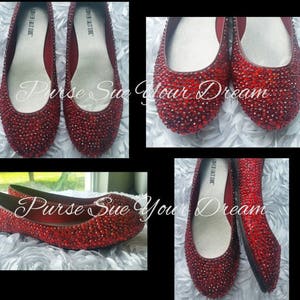 May include: A pair of red ballet flats by Lower East Side, completely covered in small red rhinestones. The interior features a light-coloured insole with the brand name printed in black. The text "Purse Sue Your Dream" is overlaid on the images.
