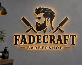 May include: A 3D wall sign featuring the text FADECRAFT BARBERSHOP in black lettering with a warm backlit glow. Above the text is a black silhouette of a bearded man with a styled haircut, flanked by two crossed straight razors.