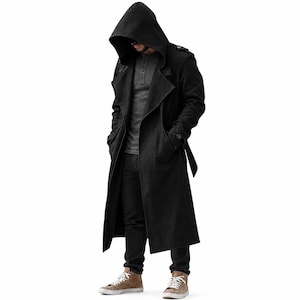 May include: A long black hooded trench coat featuring wide lapels, shoulder epaulets, and long sleeves with buttoned cuffs. The coat is worn over a dark gray henley shirt and black trousers, paired with light brown canvas sneakers.