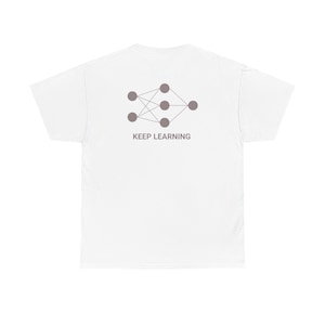 May include: A white short-sleeved t-shirt featuring a taupe-colored graphic of a neural network diagram on the back. Below the diagram, the text KEEP LEARNING is printed in a matching taupe color. The shirt has a crew neckline and short sleeves.