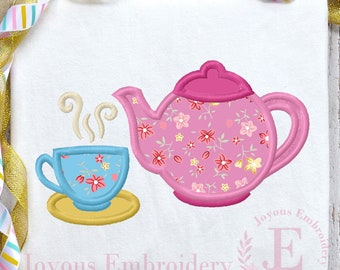 May include: Embroidered design of a pink teapot with a floral pattern and a blue teacup with a floral pattern and steam coming from the cup. The design is on a white background with the text "Joyous Embroidery" below it.