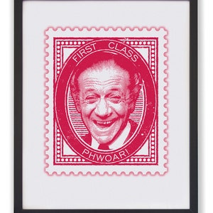 May include: Framed print with a red stamp design. The stamp features a smiling man and the words "FIRST CLASS" and "PHWOAR!". The print is on a white background, enclosed in a black frame.
