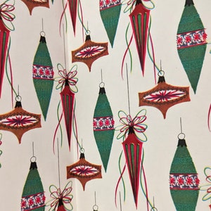 Carta da regalo natalizia vintage dell'era atomica con decorazioni rosse e verdi, anni '50