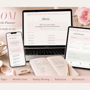 May include: A digital self-growth planner titled Bloom displayed on a laptop, tablet, and smartphone. The screen shows text including This year, you become everything you've been dreaming of and Monthly Blueprint. Includes a notebook and pen.