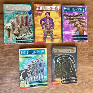 May include: A collection of five Animorphs books by K.A. Applegate. The covers feature illustrations of characters and titles like "The Extreme," "The Capture," "The Change," "The Experiment," and "The Beginning." The books are from the Scholastic series.
