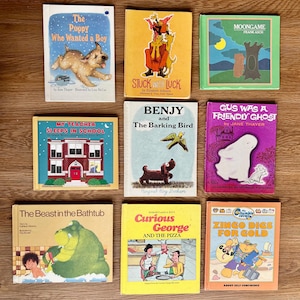 May include: A collection of nine vintage children's books with colorful covers. Titles include "The Puppy Who Wanted a Boy," "Stuck with Luck," "Moongame," "My Teacher Sleeps in School," "Benjy and The Barking Bird," and "Gus Was a Friendly Ghost."