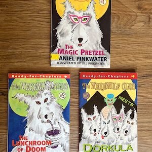 May include: Three paperback books in the "Ready-for-Chapters" series, "The Werewolf Club" with titles "The Magic Pretzel", "The Lunchroom of Doom", and "The Werewolf Club Meets Dorkula".