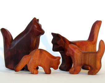Cat family carved from plum wood