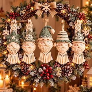 May include: A circular evergreen wreath decorated with red berries, pinecones, and a burlap bow, featuring five hanging macrame ornaments. Each ornament depicts a gnome with a crocheted hat, a fringed beard, and a star or snowflake detail.