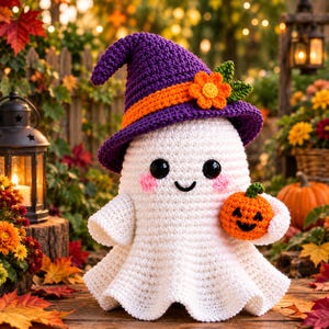 May include: A white crocheted ghost figurine wearing a purple witch hat with an orange band and a small orange flower. The ghost has black button eyes, pink stitched cheeks, a black smile, and holds a small orange crocheted pumpkin.