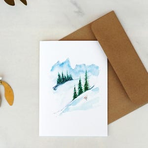 Mountain scene with downhill skier, blank Christmas card