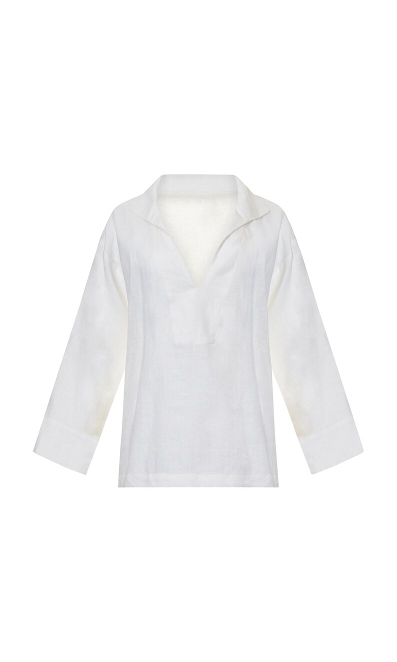 May include: A white linen shirt with a long sleeve and a v-neck collar.