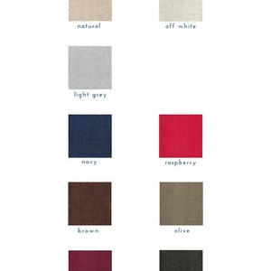 May include: Swatch cards showing different colors of linen fabric. The colors are: natural, off white, light grey, navy, raspberry, brown, olive, burgundy, and black.