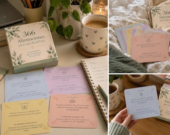 May include: A set of 366 daily affirmation cards in a box with botanical illustrations. The cards are pastel-colored, featuring Spanish text, dates, and small icons. The box cover reads 366 Afirmaciones para cada día del año.