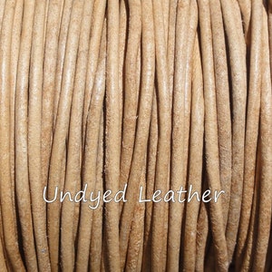 May include: Close-up of a spool of undyed leather cord. The cord is a light tan color and tightly wound. The text "Undyed Leather" is written in a cursive font across the image.