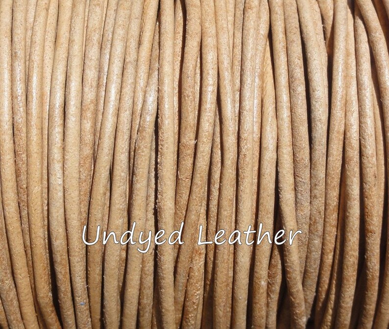 May include: Close-up of a spool of undyed leather cord. The cord is a light tan color and tightly wound. The text "Undyed Leather" is written in a cursive font across the image.