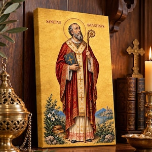Peut inclure: Une impression sur toile rectangulaire représentant une figure religieuse en vêtements rouges et dorés, tenant un livre et un bâton. Le texte SANCTVS AVGVSTINVS est imprimé en haut. Le fond est doré texturé avec un paysage en bas.