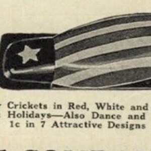 May include: A vintage-style metal cricket noisemaker featuring a red, white, and blue striped pattern with a white star on a blue field. The text below reads: No. 15 Old Glory Crickets in Red, White and Blue for July 4th and All Patriotic Holidays.
