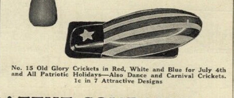 May include: A vintage-style metal cricket noisemaker featuring a red, white, and blue striped pattern with a white star on a blue field. The text below reads: No. 15 Old Glory Crickets in Red, White and Blue for July 4th and All Patriotic Holidays.