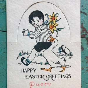 May include: A vintage Easter greeting card featuring a boy in a striped shirt carrying a bouquet of yellow daffodils while riding on a goose. The card reads "Happy Easter Greetings" and is signed "Queen".