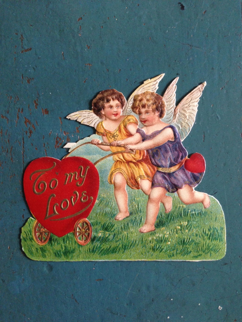Antique Victorian Valentine's Day Embossed Scrap Die Cut Two Cupids Pushing Heart Cart February 14th Early 1900s Collectible image 1