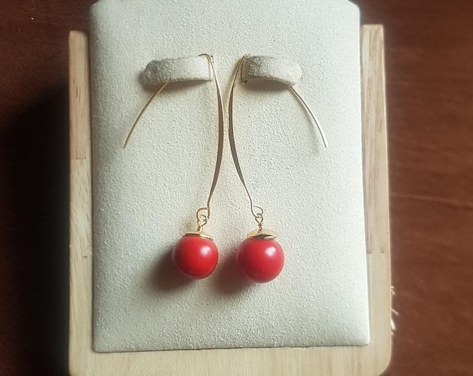 14mm dyed red coral with gold plate earrings. Simple and dynamic. Unusual beads.