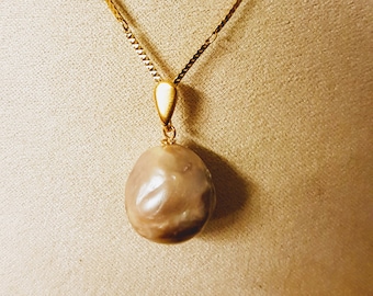 Golden baroque pearl pendant 20mm x 15mm (approx.) with gold-filled bail. Due to uniqueness of beads shapes may differ slightly.