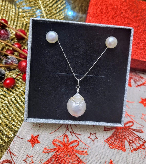 AAA Baroque pearl pendant 20 x 15mm approx. with matching studs and 16" chain. Excellent gift. Comes boxed.