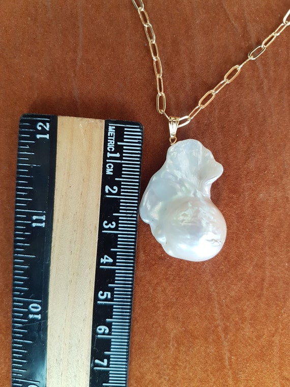 AAA Large baroque pearl pendant 32 x 24mm approx. High luster pearl. Each piece is awesome & unique. Very beautiful. Chain not included.