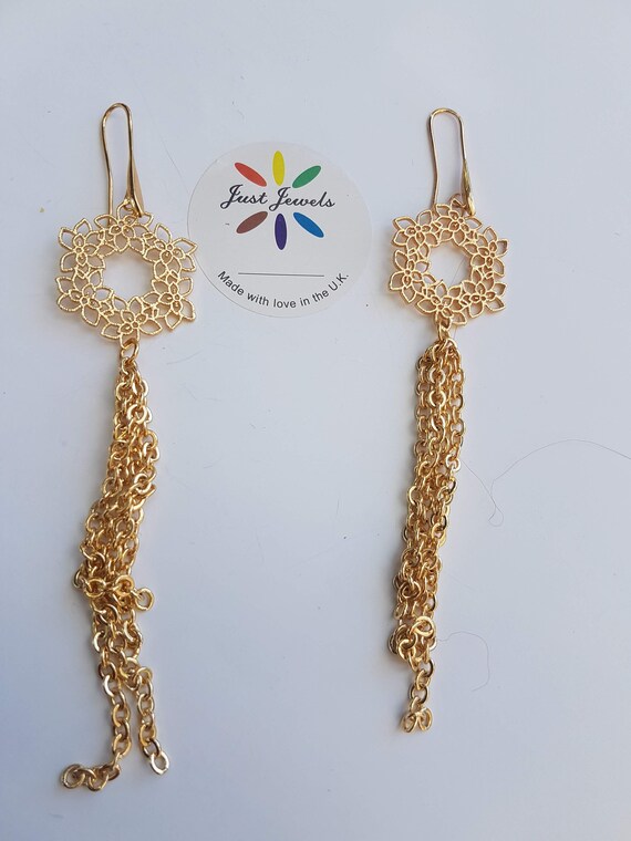 Unique gold earrings comes in organza gift bag. Large flower design, very elegant.