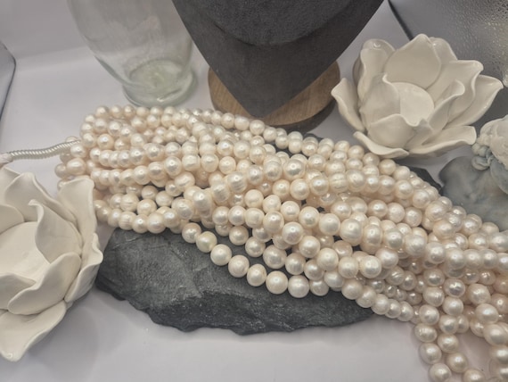 A+ grade 13-15mm oval freshwater pearls for jewelry designers. Full string is 15 inches. Ideal for crafting gorgeous necklaces.