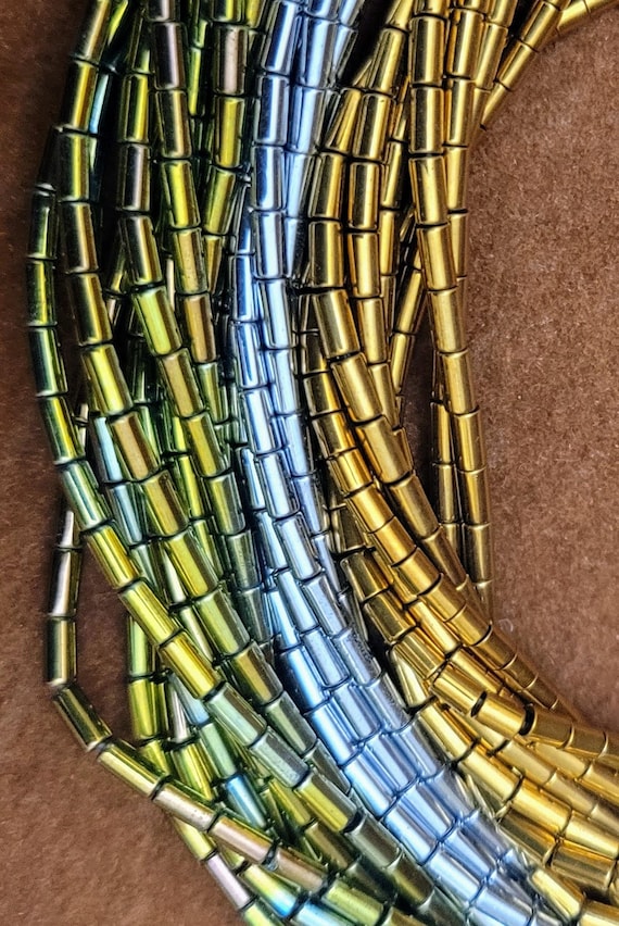 Coated hematite tiny tubes. 4mm x 1mm small beads. 16mm long string of beads. Choice of 3 beautiful colours. Antique gold, silver or green.