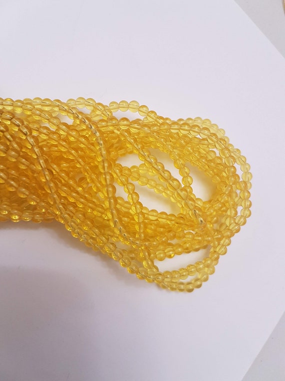 4mm yellow transparent beads on string 15.5 inches long. Super fast delivery from the UK!!!