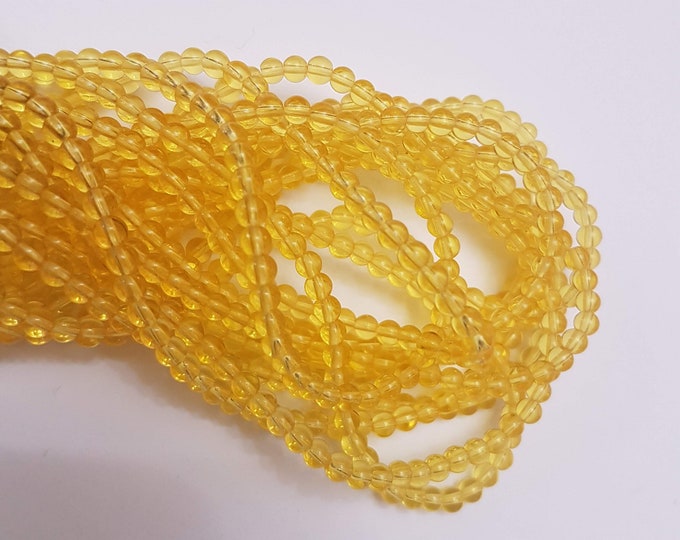 4mm yellow transparent beads on string 15.5 inches long. Super fast delivery from the UK!!!