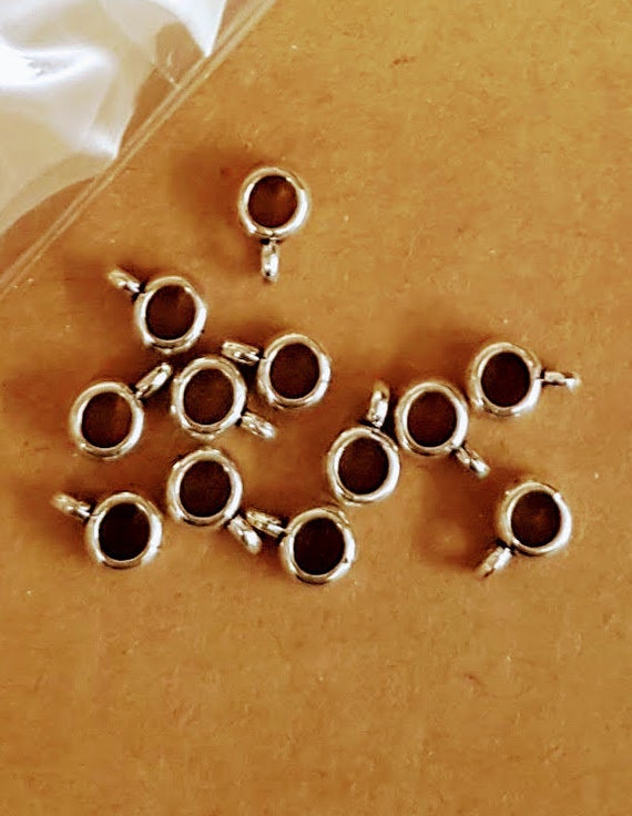 7mm silver bail.  (20 pieces). For jewellery and craft projects. Hole is 5mm. Hoop 5mm with 2mm hole.