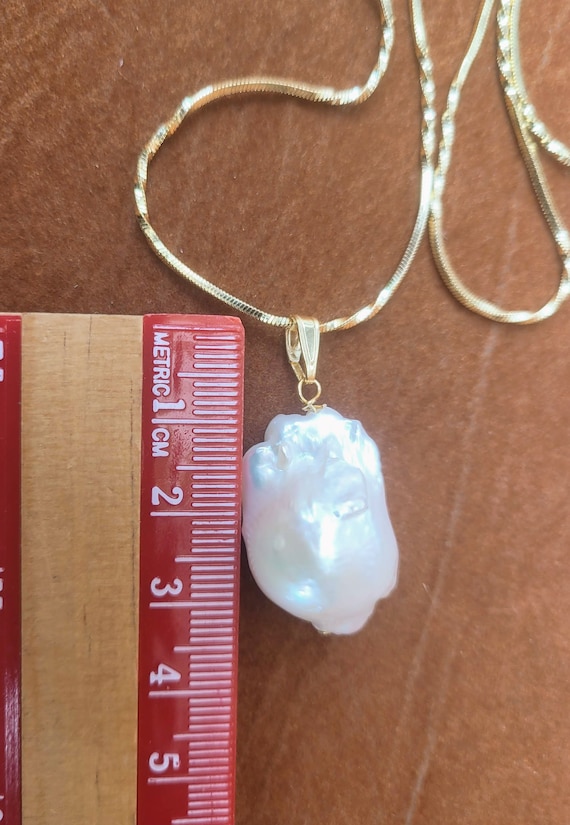 9ct gold & baroque pearl large pendant 30 x 20mm approx. High luster pearl. Each piece is awesome and unique. Very beautiful.  Only pendant.